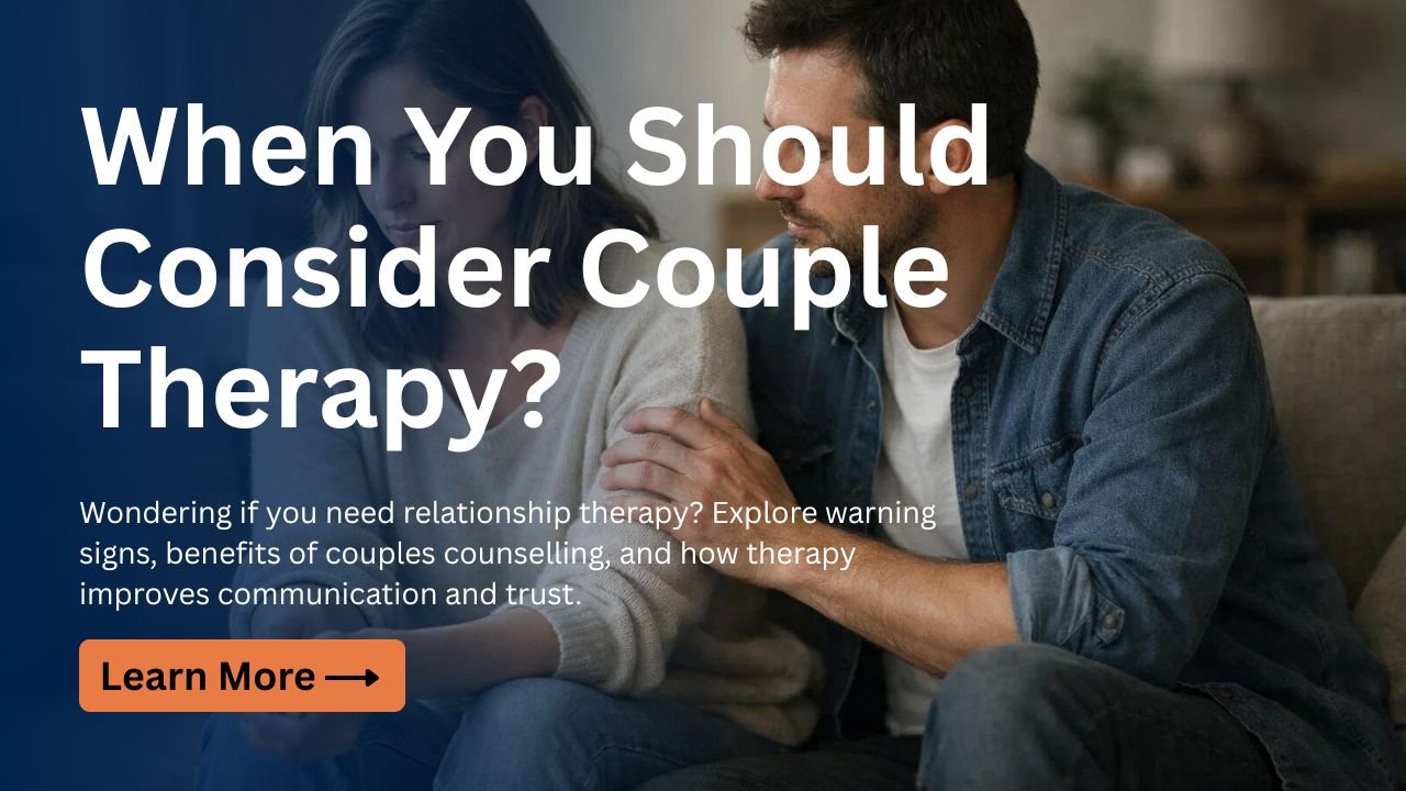 Couple sitting together on a sofa looking concerned during a relationship discussion