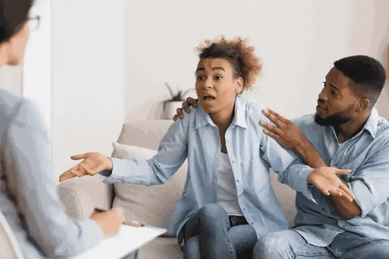 Couple having an emotional conversation during therapy